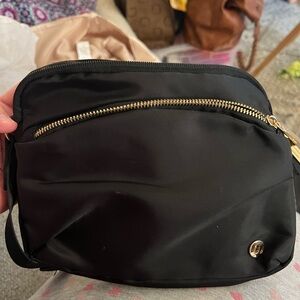 Elegant Black Crossbody Bag with Gold Zipper
